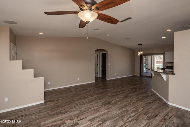 679 Apache Dr, Lake Havasu City, AZ 86406 - unfurnished living room featuring arched walkways, a ceiling fan, dark wood-style floors, vaulted ceiling, and recessed lighting