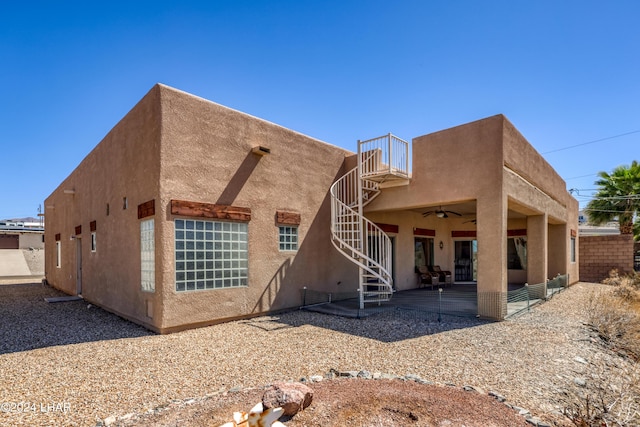 back of property featuring a patio and ceiling fan