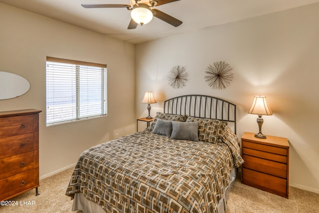 bedroom featuring ceiling fan and light colored carpet