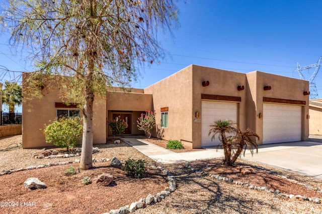 adobe home featuring a garage