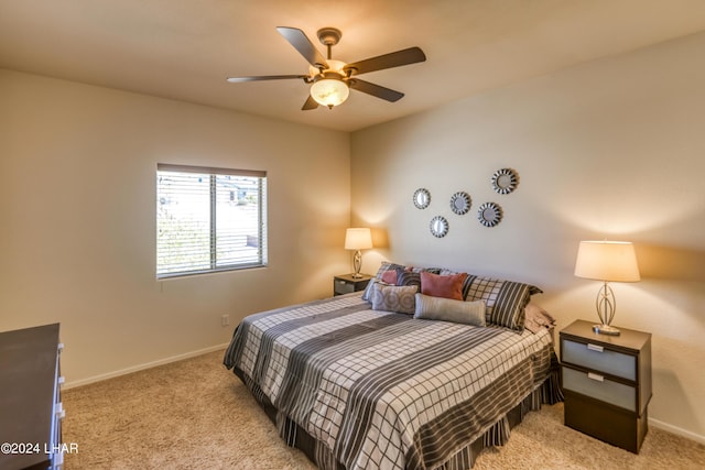 bedroom with light colored carpet and ceiling fan