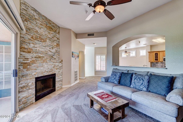 1650 Smoketree Ave Unit 202, Lake Havasu City, AZ 86403 - carpeted living room with a fireplace and ceiling fan