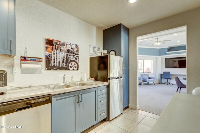 1650 Smoketree Ave Unit 202, Lake Havasu City, AZ 86403 - kitchen with stainless steel appliances, sink, light carpet, and ceiling fan