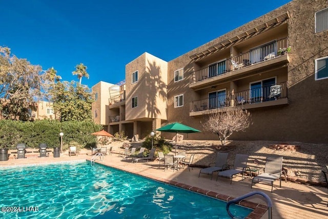 view of pool featuring a patio area