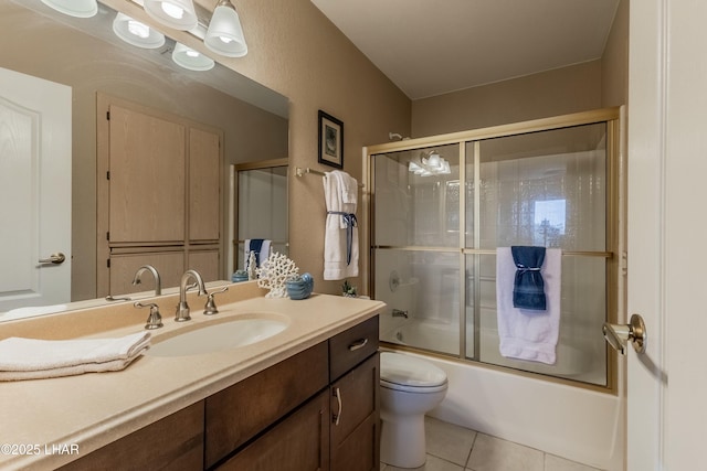 777 Harrah Way Unit 112, Lake Havasu City, AZ 86403 - bathroom with toilet, tile patterned floors, enclosed tub / shower combo, and vanity
