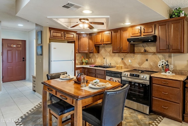 777 Harrah Way Unit 112, Lake Havasu City, AZ 86403 - kitchen with stainless steel electric range oven, a sink, freestanding refrigerator, dishwashing machine, and under cabinet range hood
