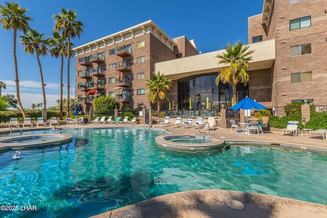777 Harrah Way Unit 112, Lake Havasu City, AZ 86403 - view of pool featuring a patio area, fence, and a pool with connected hot tub