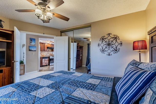 777 Harrah Way Unit 112, Lake Havasu City, AZ 86403 - bedroom featuring a textured ceiling, a closet, light tile patterned floors, and a ceiling fan