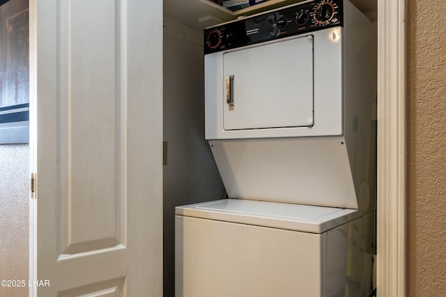 777 Harrah Way Unit 112, Lake Havasu City, AZ 86403 - washroom featuring a textured wall, stacked washer / dryer, and laundry area