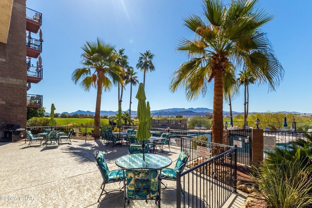 777 Harrah Way Unit 112, Lake Havasu City, AZ 86403 - view of patio featuring fence, a grill, and a mountain view