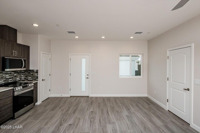 2080 Swanson Ave Unit F, Lake Havasu City, AZ 86403 - kitchen with light wood-type flooring, appliances with stainless steel finishes, and visible vents