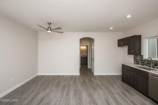 2080 Swanson Ave Unit F, Lake Havasu City, AZ 86403 - kitchen featuring light countertops, ceiling fan, arched walkways, dishwasher, and a sink