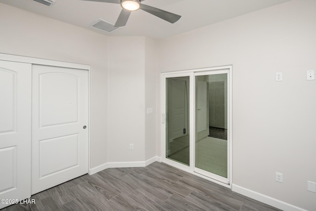 2080 Swanson Ave Unit F, Lake Havasu City, AZ 86403 - unfurnished bedroom with a closet, baseboards, a ceiling fan, visible vents, and wood finished floors