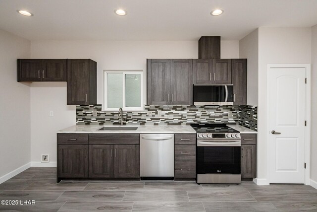 2080 Swanson Ave Unit F, Lake Havasu City, AZ 86403 - kitchen with a sink, light countertops, appliances with stainless steel finishes, dark brown cabinetry, and decorative backsplash