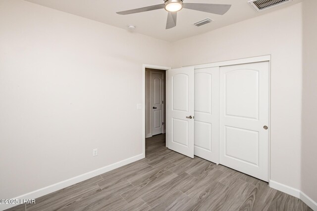 2080 Swanson Ave Unit F, Lake Havasu City, AZ 86403 - unfurnished bedroom featuring a closet, visible vents, baseboards, and light wood-style flooring