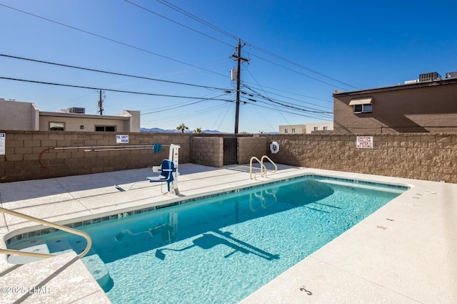 2080 Swanson Ave Unit F, Lake Havasu City, AZ 86403 - pool featuring a patio, central AC unit, and a fenced backyard