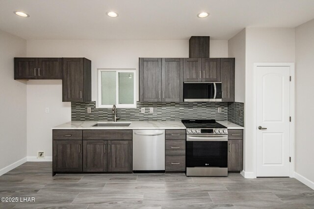 2080 Swanson Ave Unit F, Lake Havasu City, AZ 86403 - kitchen with a sink, light countertops, appliances with stainless steel finishes, and dark brown cabinetry