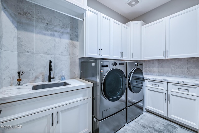 816 Isola Bella Loop, Lake Havasu City, AZ 86403 - laundry room featuring cabinet space and washer and dryer