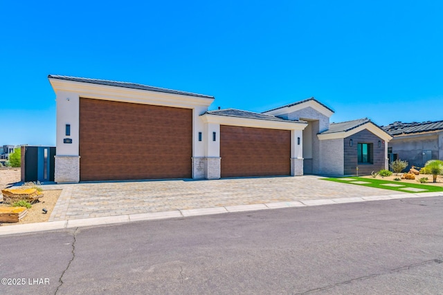 816 Isola Bella Loop, Lake Havasu City, AZ 86403 - view of front of property featuring a garage, decorative driveway, and stucco siding