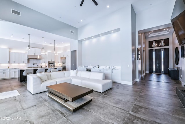816 Isola Bella Loop, Lake Havasu City, AZ 86403 - living room featuring a high ceiling, recessed lighting, and ceiling fan