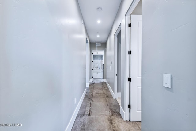 816 Isola Bella Loop, Lake Havasu City, AZ 86403 - corridor featuring concrete flooring and recessed lighting