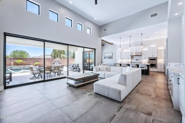 816 Isola Bella Loop, Lake Havasu City, AZ 86403 - living area with a high ceiling and recessed lighting