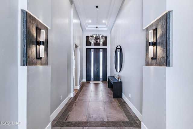 816 Isola Bella Loop, Lake Havasu City, AZ 86403 - entrance foyer with a chandelier, recessed lighting, a raised ceiling, and concrete floors