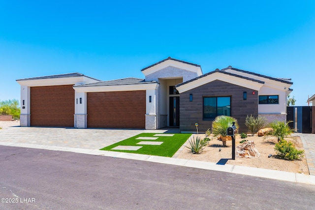 816 Isola Bella Loop, Lake Havasu City, AZ 86403 - view of front facade with a garage and decorative driveway