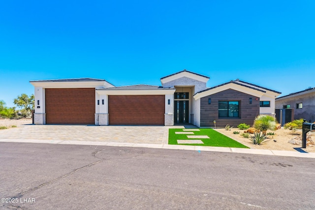 816 Isola Bella Loop, Lake Havasu City, AZ 86403 - view of front facade featuring an attached garage and decorative driveway
