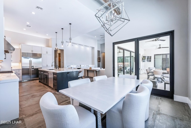 816 Isola Bella Loop, Lake Havasu City, AZ 86403 - dining space with ceiling fan, recessed lighting, and a towering ceiling