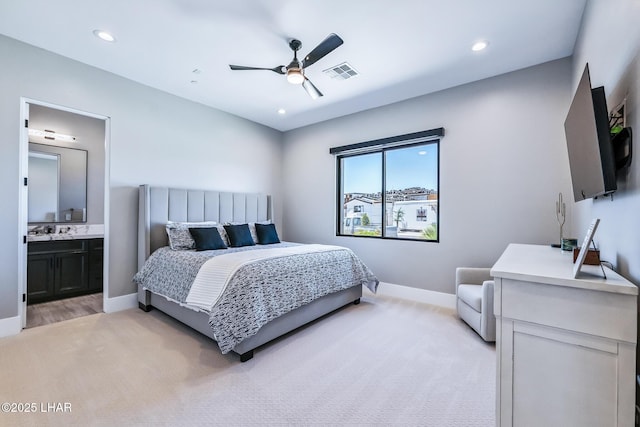 816 Isola Bella Loop, Lake Havasu City, AZ 86403 - bedroom with light carpet, connected bathroom, recessed lighting, and a ceiling fan