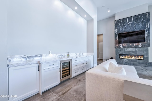 816 Isola Bella Loop, Lake Havasu City, AZ 86403 - indoor bar featuring beverage cooler, recessed lighting, and a high end fireplace