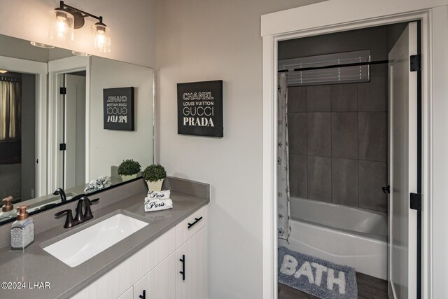 bathroom featuring vanity and shower / bath combo with shower curtain