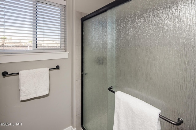 bathroom with an enclosed shower