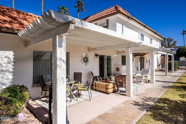 view of patio / terrace featuring outdoor dining area and a pergola