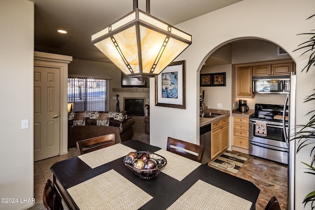 dining space featuring sink