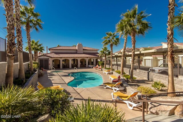 view of swimming pool featuring a patio