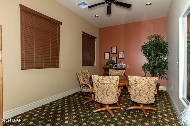 dining space with carpet flooring and ceiling fan