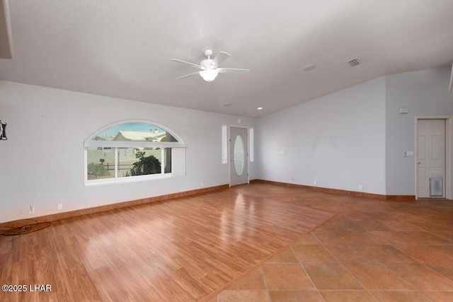 2624 Rainbow Ave N, Lake Havasu City, AZ 86403 - unfurnished living room featuring wood finished floors, a ceiling fan, visible vents, and baseboards