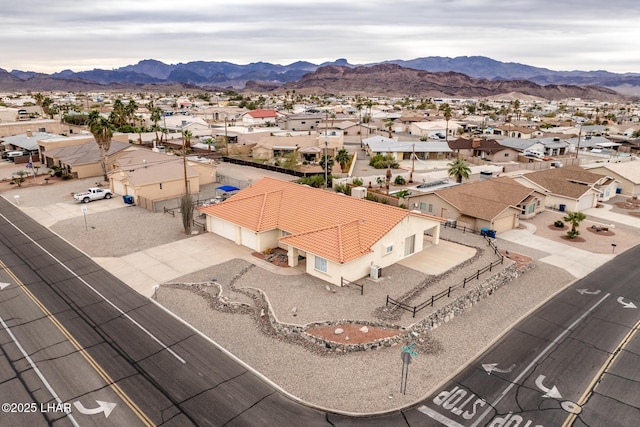 birds eye view of property with a mountain view