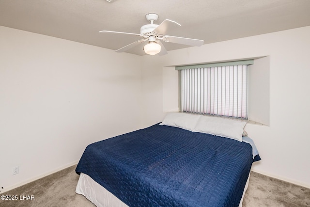 bedroom with light colored carpet and ceiling fan