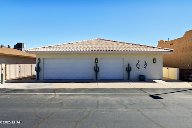 8731 Yaqui, Parker, AZ 85344 - garage with driveway, central AC, and fence
