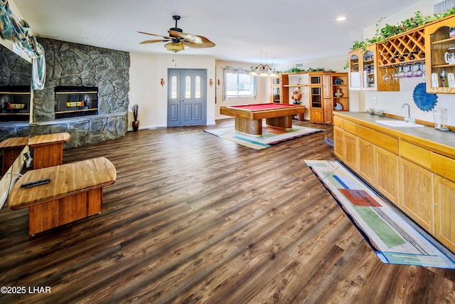8731 Yaqui, Parker, AZ 85344 - playroom with dark wood-style flooring, a fireplace, a sink, billiards, and indoor wet bar
