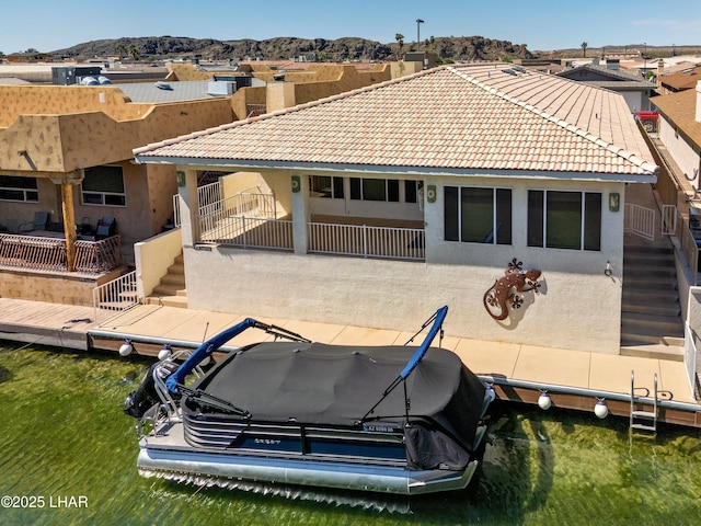 8731 Yaqui, Parker, AZ 85344 - back of house with a mountain view, stucco siding, a tiled roof, and stairway