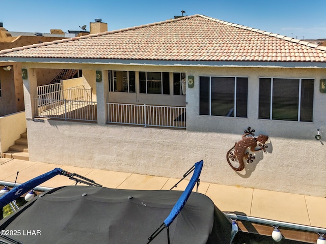 8731 Yaqui, Parker, AZ 85344 - back of house with a tile roof, stucco siding, and a chimney