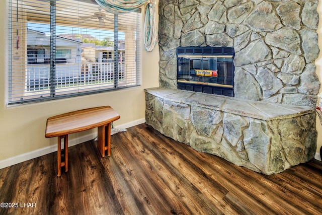 8731 Yaqui, Parker, AZ 85344 - interior space featuring baseboards, a fireplace, and wood finished floors