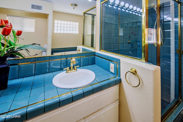 8731 Yaqui, Parker, AZ 85344 - bathroom with a shower stall, visible vents, tasteful backsplash, and vanity