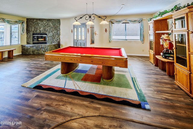 8731 Yaqui, Parker, AZ 85344 - playroom with a stone fireplace, baseboards, pool table, and wood finished floors