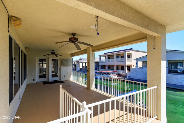 8731 Yaqui, Parker, AZ 85344 - view of patio / terrace with a balcony, a ceiling fan, and a residential view