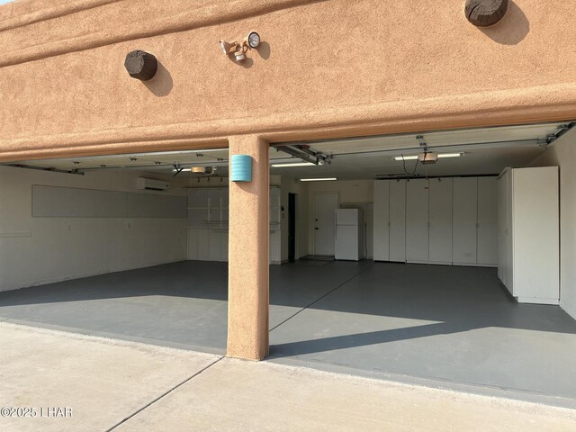 875 Wallingford Pl, Lake Havasu City, AZ 86406 - garage featuring freestanding refrigerator and driveway